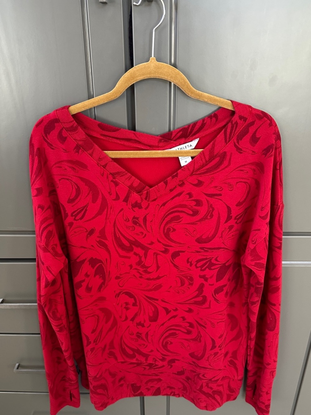 Athleta Red V-Neck Long Sleeve Top with Tonal Swirl